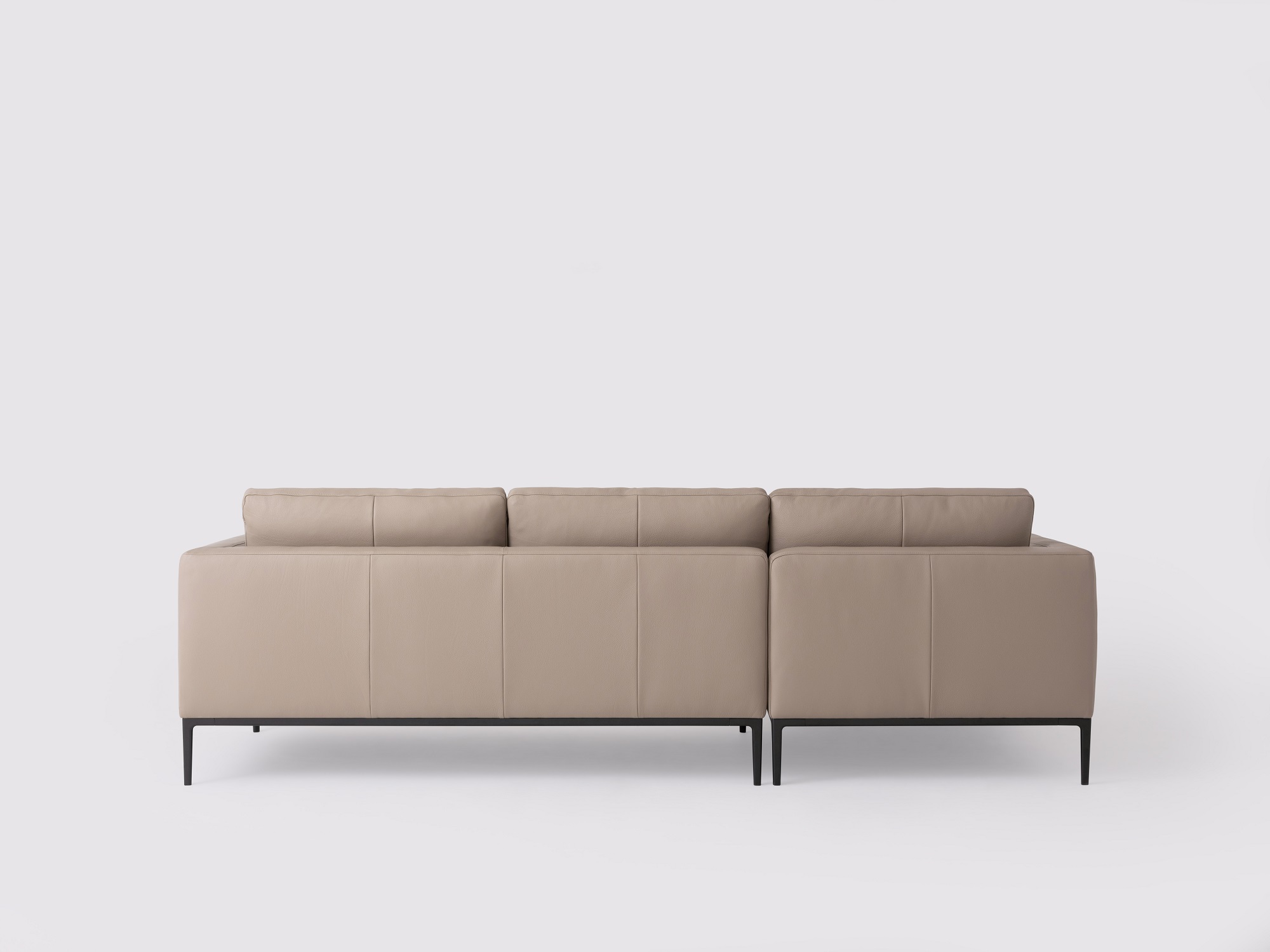 Back view of the Oma modern sectional couch in grey leather